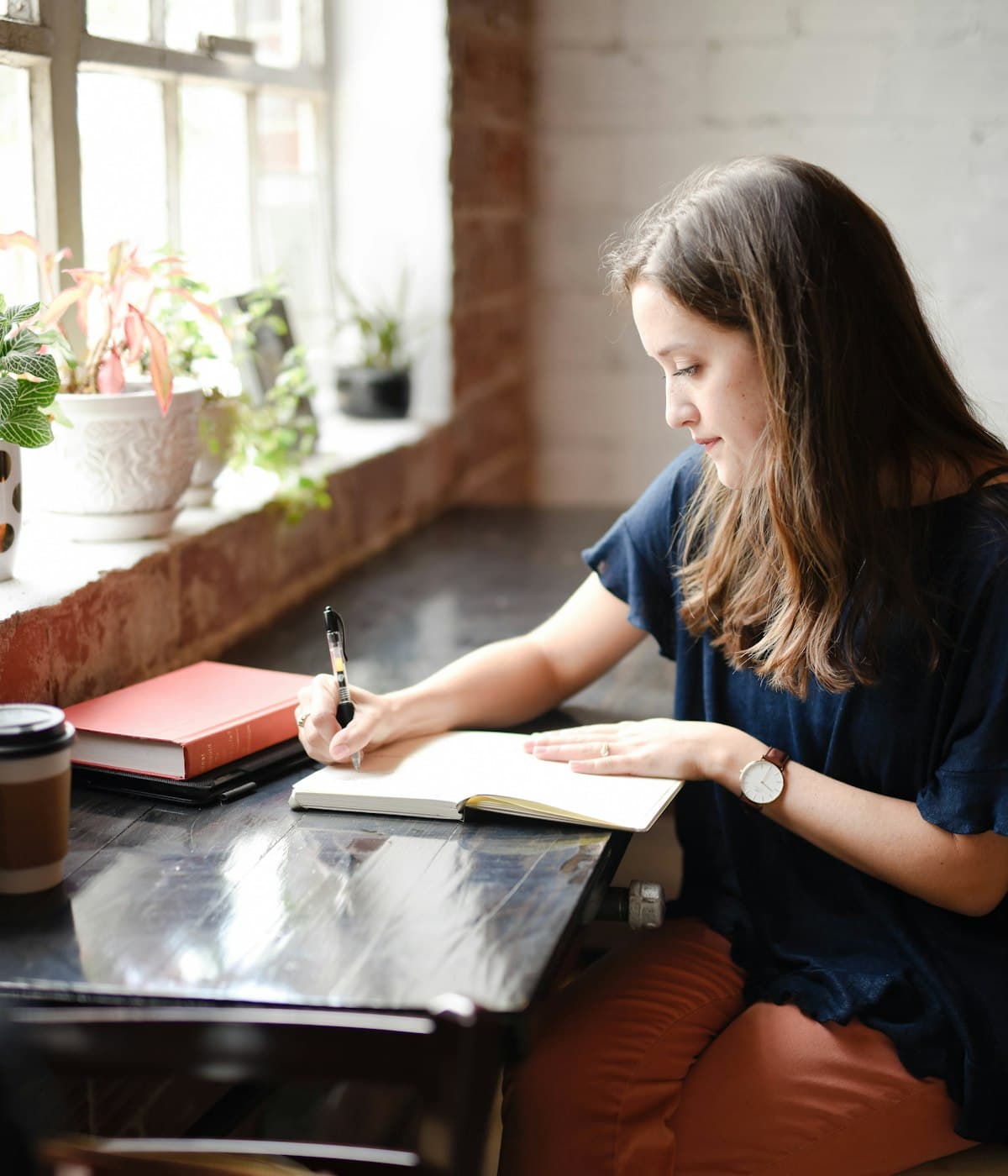 A woman writing in a journal